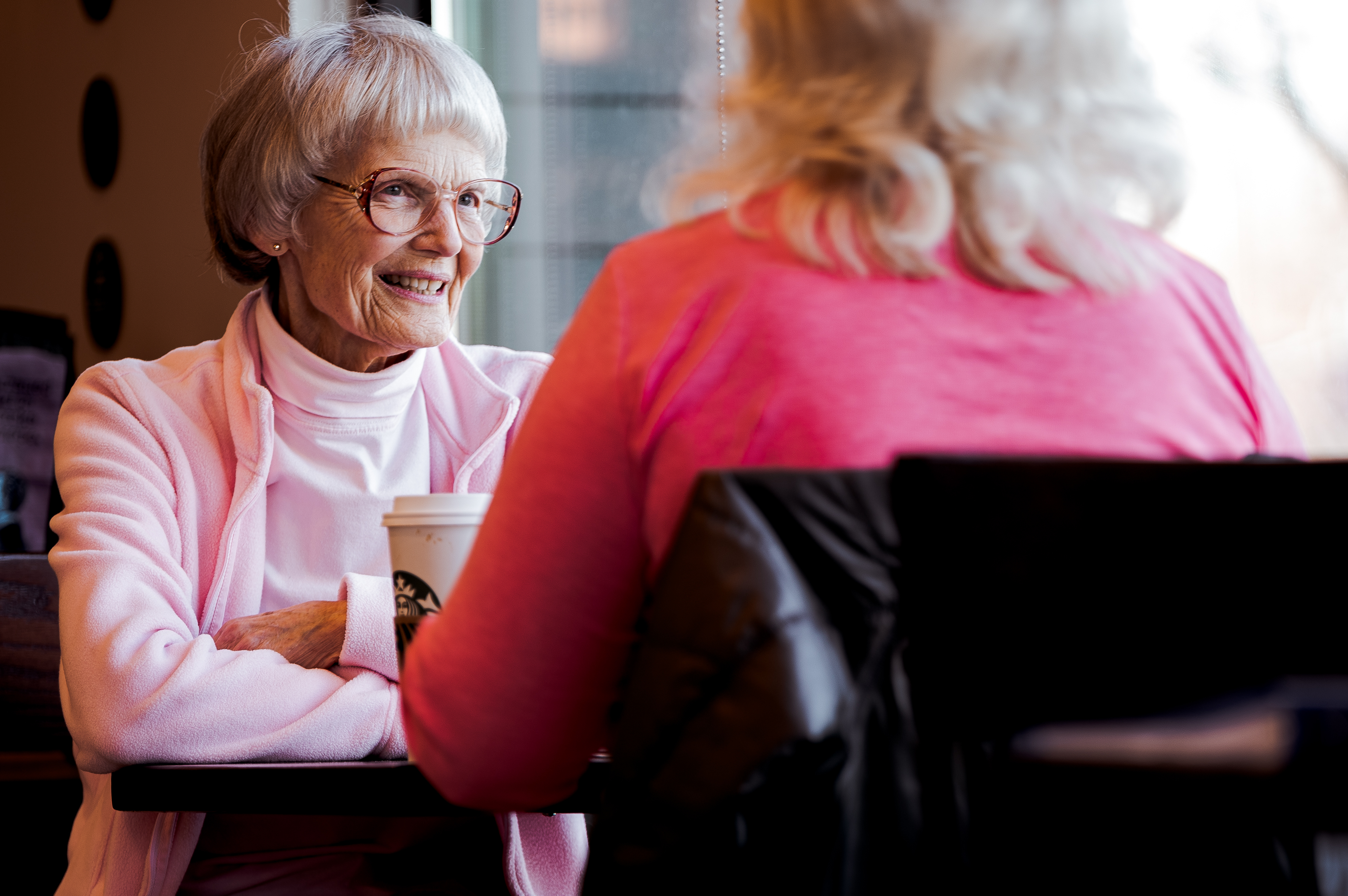 Canva Photo of Old Woman Sitting While Talking With Another Woman